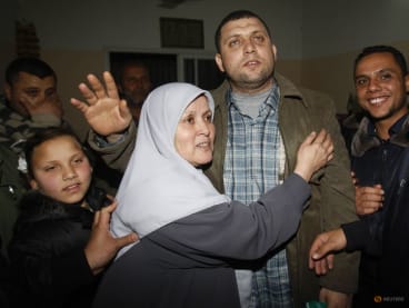 FILE PHOTO: Ayman Nofal (2nd R), a top Hamas armed commander, is greeted by his relatives upon his arrival to his home in Nusairat in the Central Gaza strip February 5, 2011. REUTERS/Ibraheem Abu Mustafa/File Photo