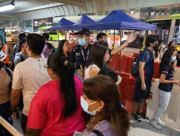 Police directing commuters during a temporary closure of Novena MRT station on Oct 27, 2023 after smoke was detected there.